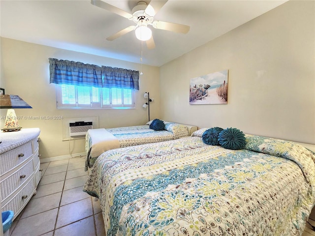 tiled bedroom featuring an AC wall unit and ceiling fan