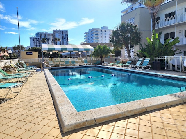 view of swimming pool featuring a patio area