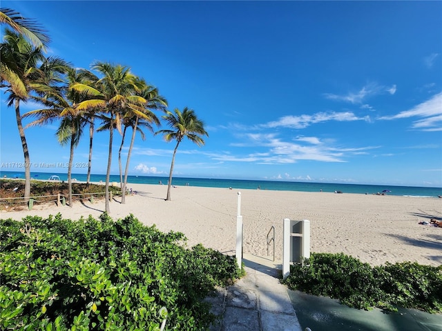 property view of water featuring a beach view