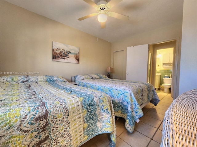1504 S Surf Rd Unit 57, Hollywood, FL 33019 - tiled bedroom with a ceiling fan and ensuite bathroom