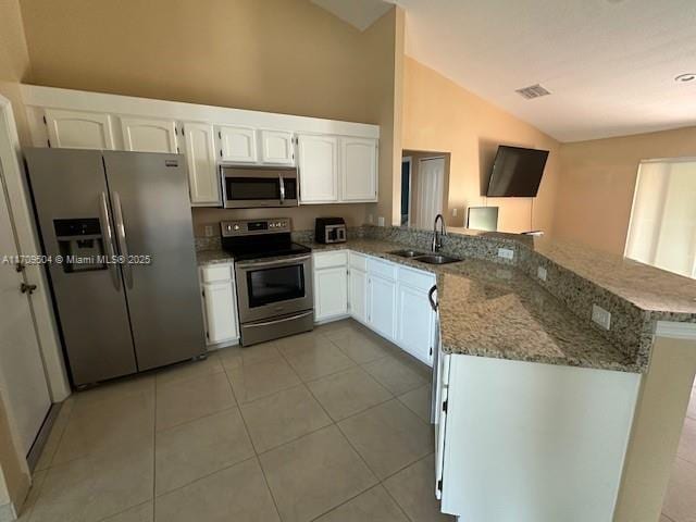 kitchen with white cabinetry, stainless steel appliances, sink, kitchen peninsula, and light stone counters