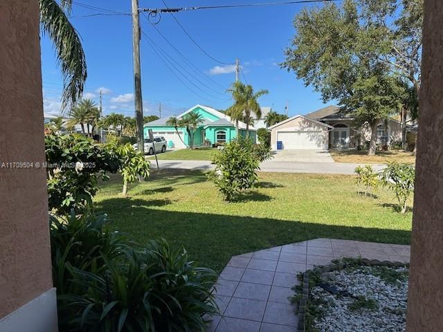 view of yard featuring a garage