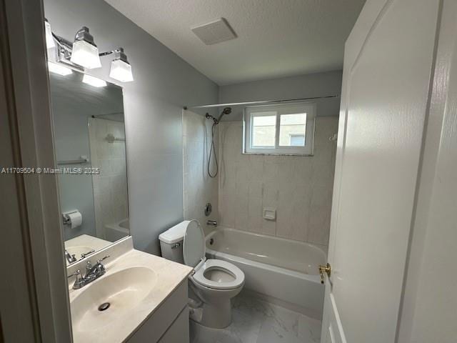 full bathroom with toilet, a textured ceiling, tiled shower / bath combo, and vanity