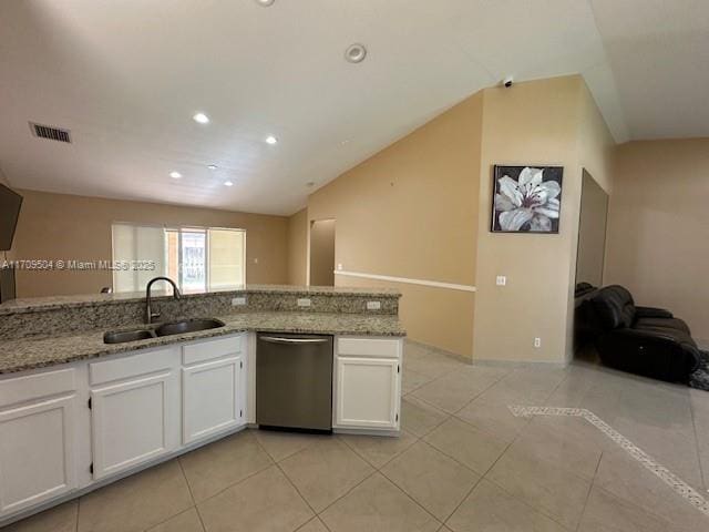 kitchen with light stone countertops, dishwasher, white cabinets, and sink