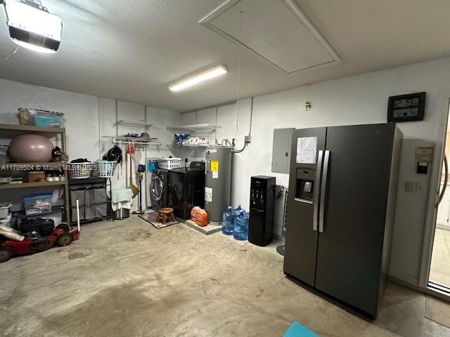 interior space featuring stainless steel refrigerator with ice dispenser and water heater