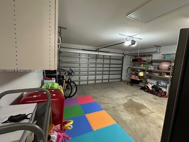 garage featuring a garage door opener