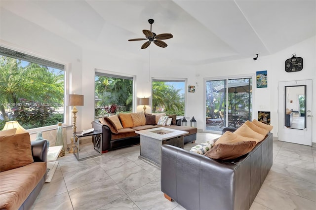 living room with ceiling fan and a healthy amount of sunlight