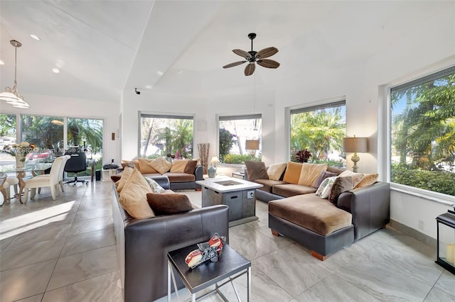 living room featuring ceiling fan and lofted ceiling