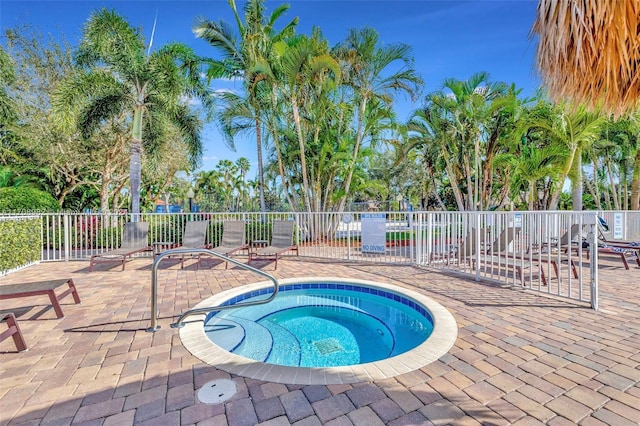 view of pool featuring a patio area and a hot tub