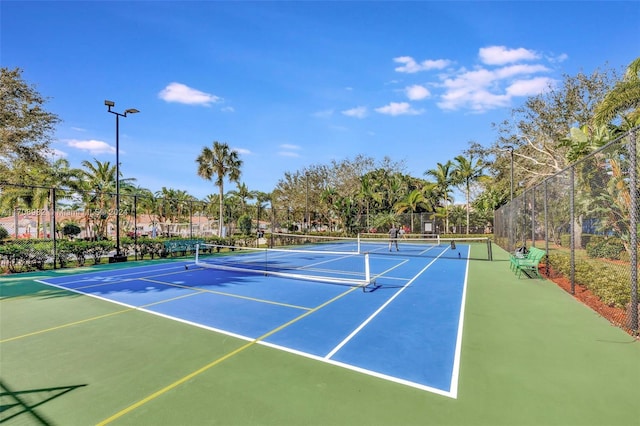 view of sport court with basketball hoop