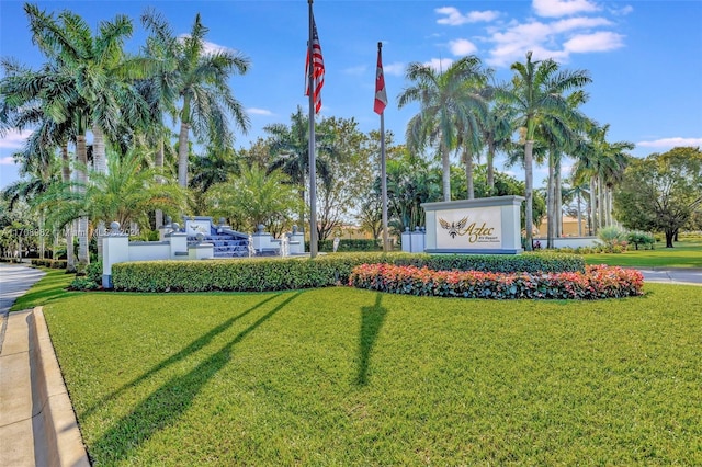 community sign featuring a lawn