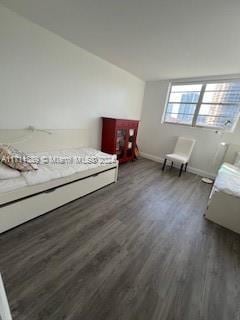 unfurnished bedroom featuring dark hardwood / wood-style floors