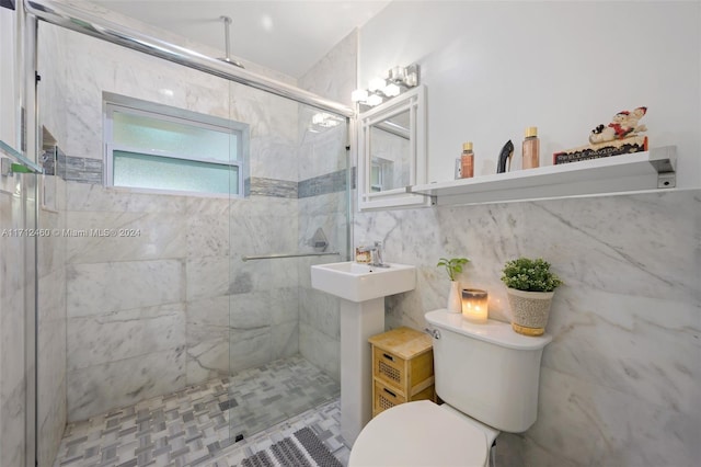 bathroom with backsplash, toilet, a shower with door, and tile walls