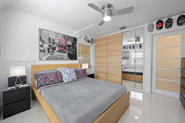 bedroom featuring ceiling fan and light tile patterned flooring