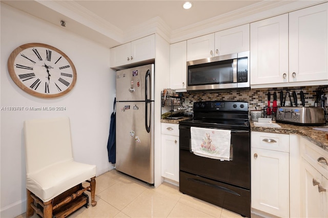 kitchen featuring stainless steel appliances, dark stone counters, decorative backsplash, white cabinets, and ornamental molding