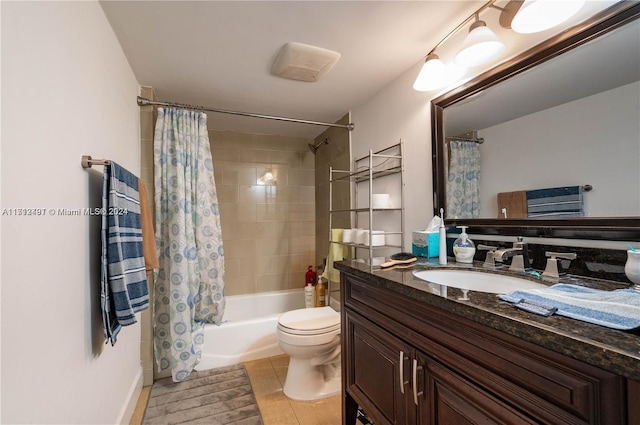 full bathroom featuring toilet, vanity, tile patterned flooring, and shower / tub combo with curtain