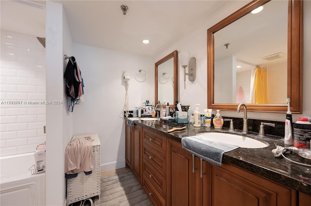 bathroom with vanity and hardwood / wood-style flooring