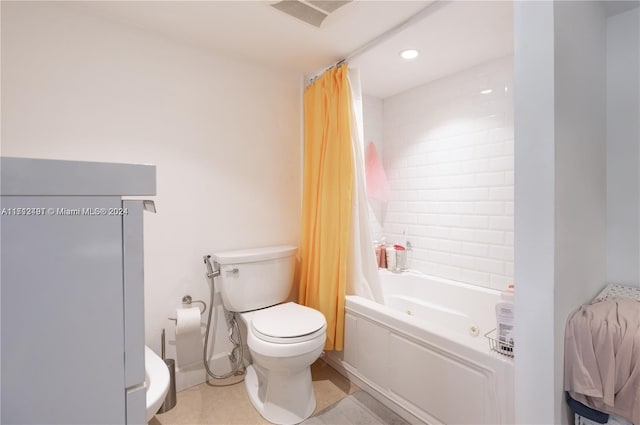 bathroom with shower / bath combo and toilet