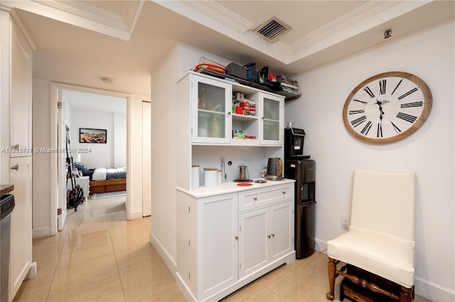 bar featuring white cabinetry, crown molding, dishwasher, and light tile patterned flooring