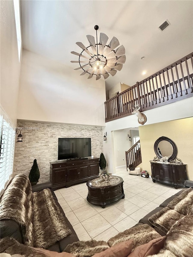 living room featuring a high ceiling and light tile patterned flooring