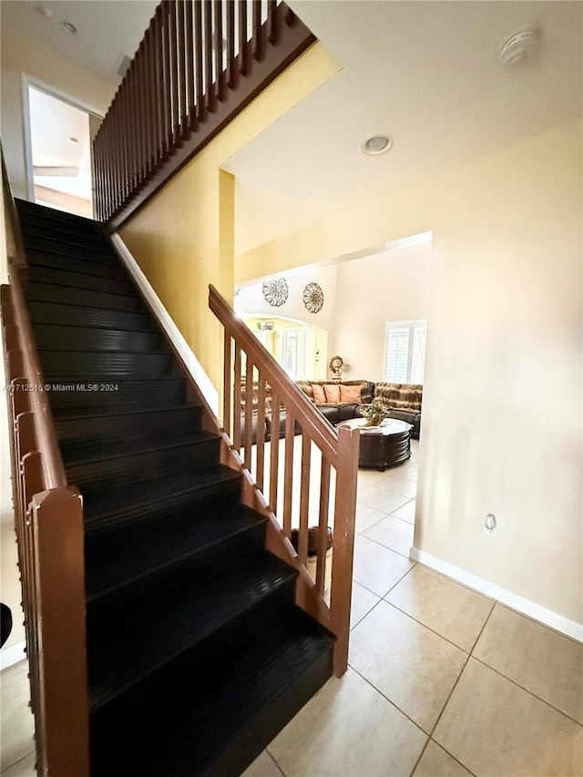 stairway featuring tile patterned floors