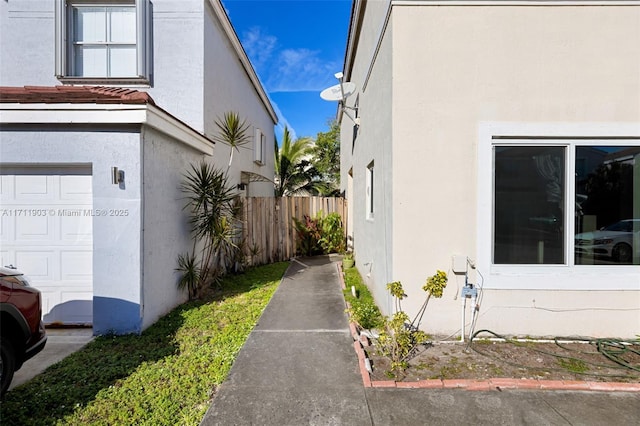 view of side of home featuring a garage