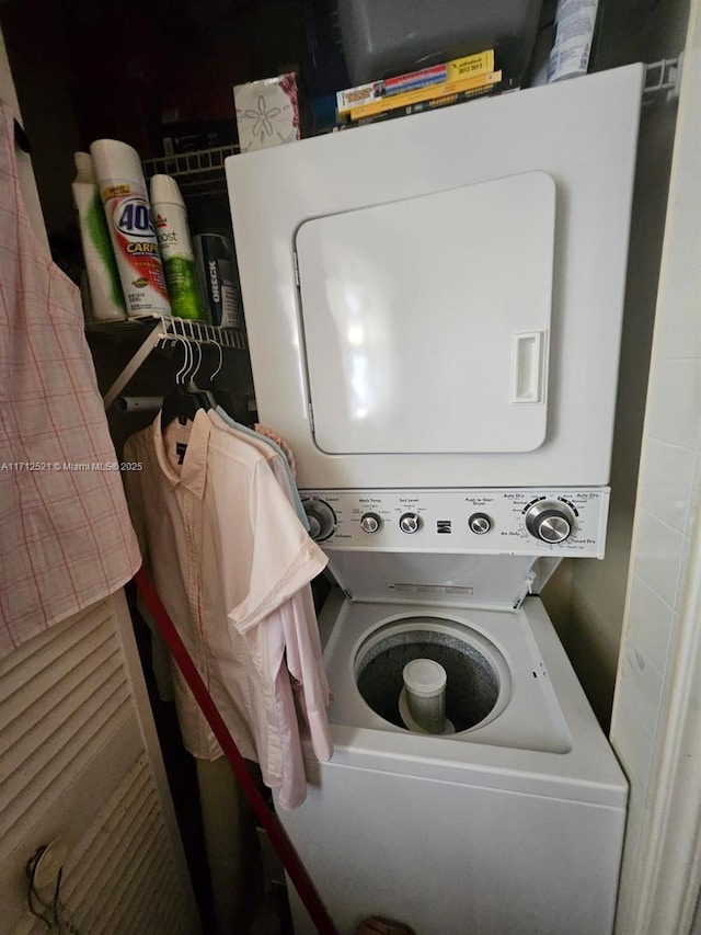 laundry room featuring stacked washing maching and dryer