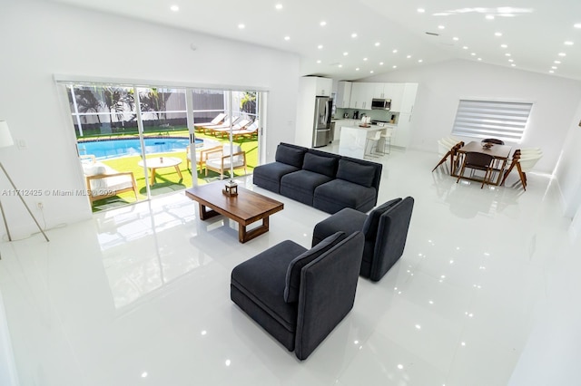 tiled living room featuring lofted ceiling