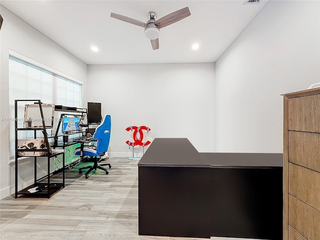 office area with ceiling fan and light hardwood / wood-style flooring