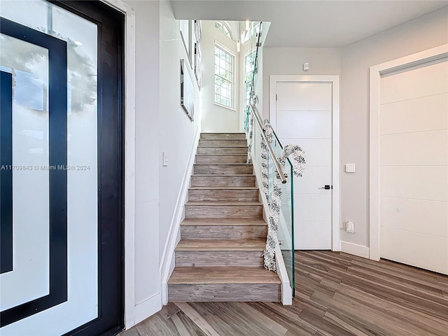 stairs with wood-type flooring