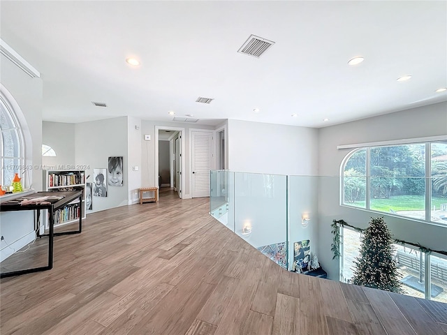 hall with light wood-type flooring