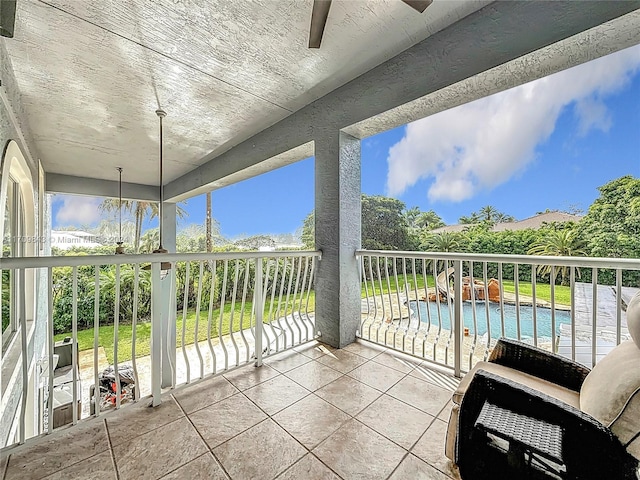 exterior space with a water view and ceiling fan