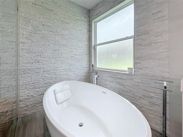 bathroom featuring a washtub