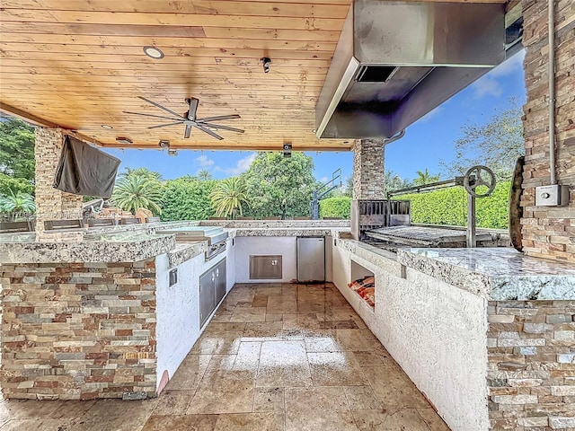 view of patio / terrace featuring area for grilling and ceiling fan