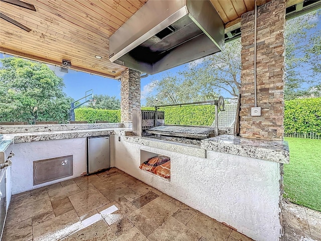 view of patio featuring exterior kitchen