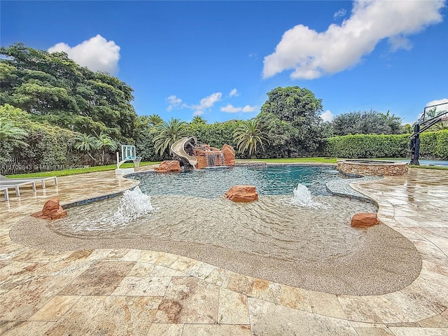 view of pool featuring pool water feature and a water slide