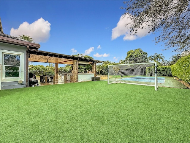 view of yard featuring tennis court