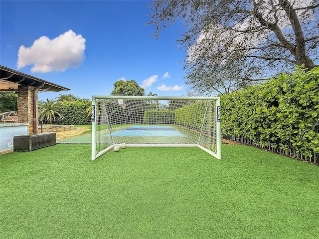 view of yard featuring tennis court