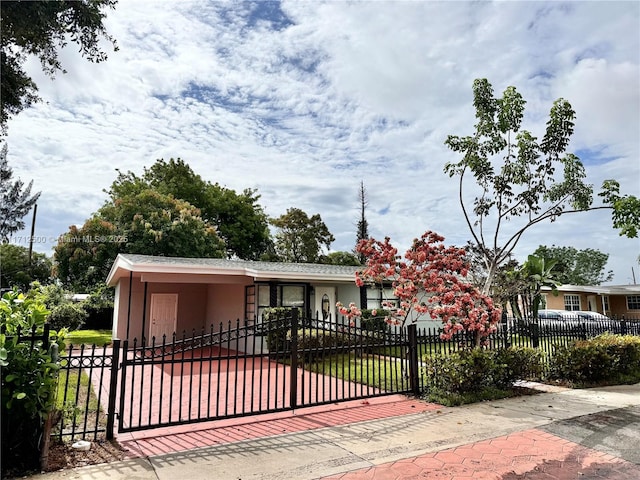 view of front of property featuring a carport