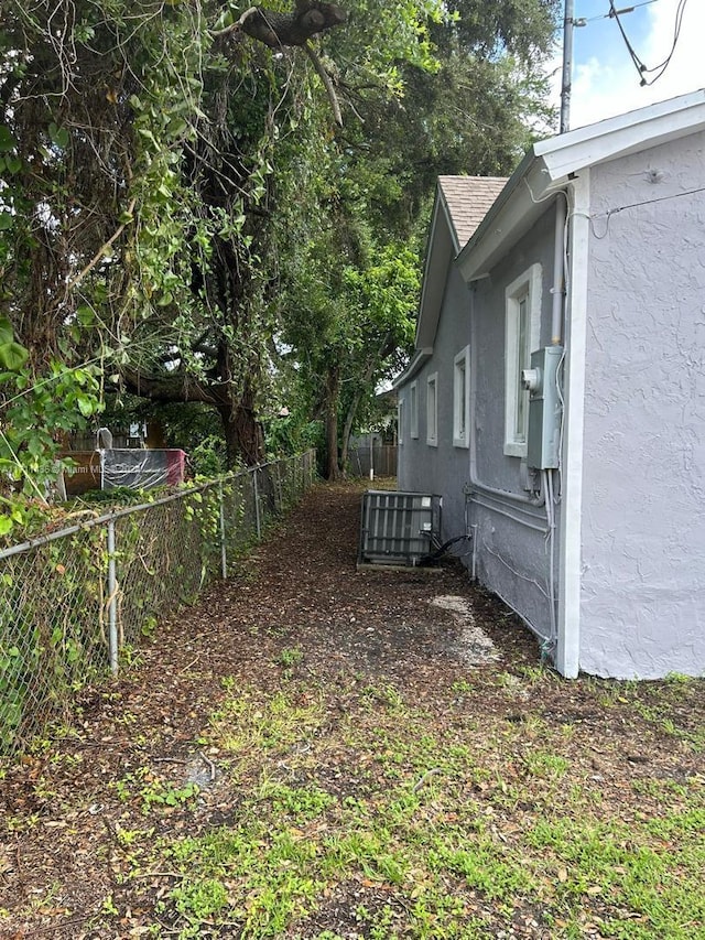 view of yard featuring central air condition unit