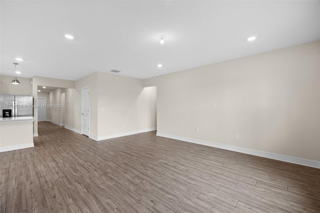 unfurnished living room with light hardwood / wood-style flooring