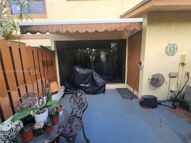 doorway to property with a patio