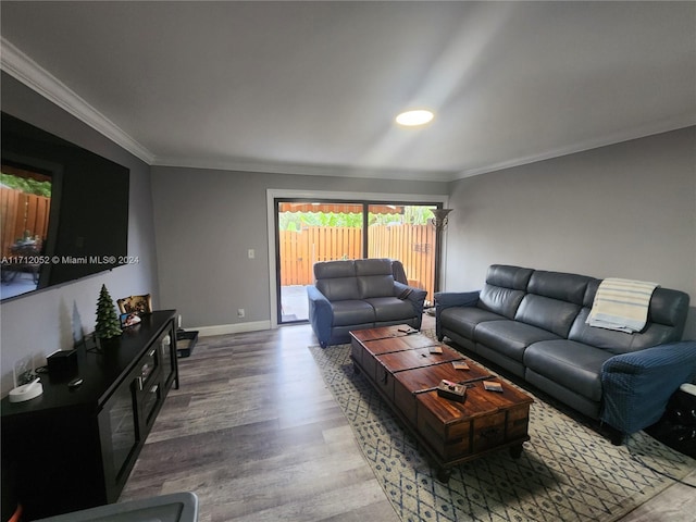 living room featuring hardwood / wood-style floors and crown molding