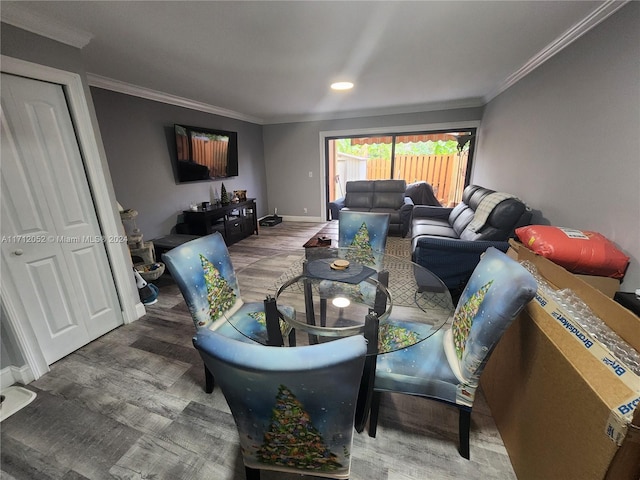 living room with crown molding and hardwood / wood-style flooring