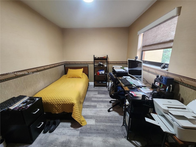 bedroom featuring wood-type flooring