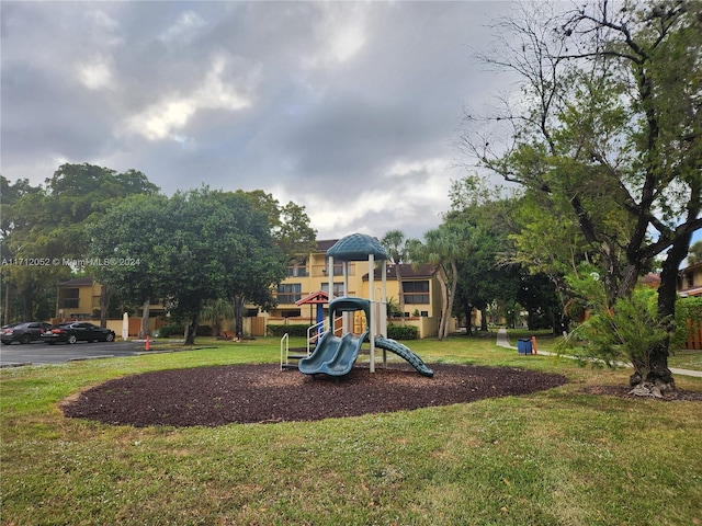 view of play area featuring a lawn