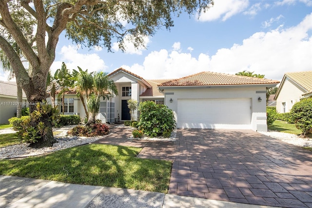 mediterranean / spanish house featuring a garage