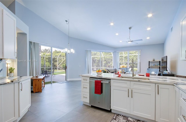 kitchen featuring pendant lighting, vaulted ceiling, stainless steel dishwasher, ceiling fan, and white cabinetry