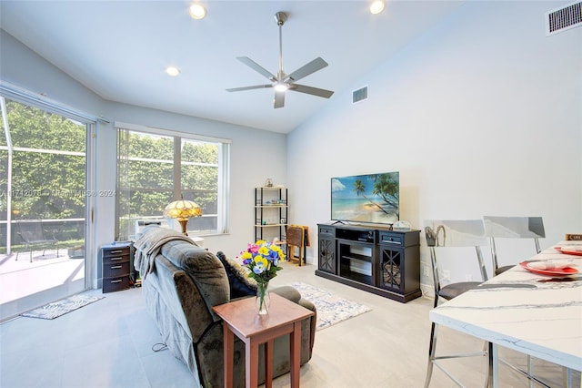 living room featuring high vaulted ceiling and ceiling fan