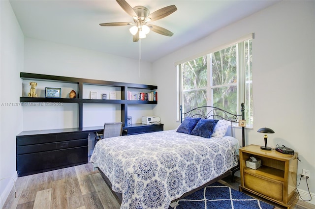 bedroom featuring light hardwood / wood-style floors and ceiling fan